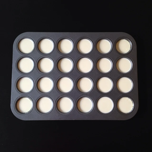 an image of baking pan filled with empty cupcake pans