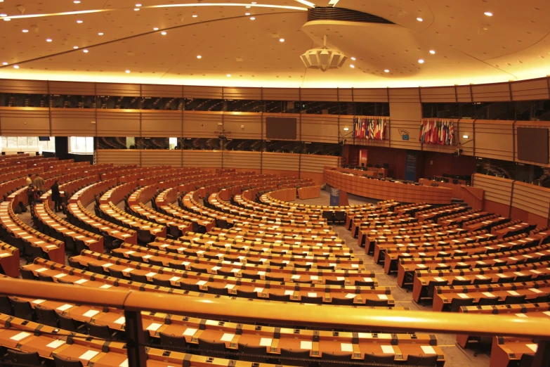 a large room filled with tables and chairs and a dome ceiling