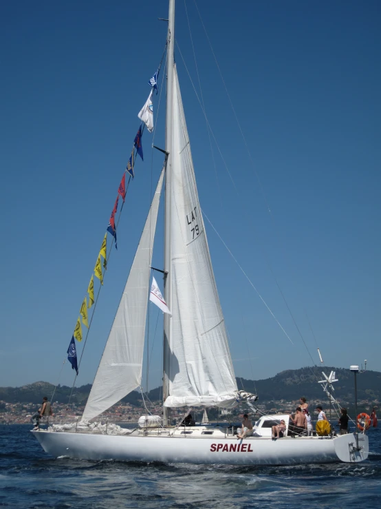 a sailboat with a group of people on it