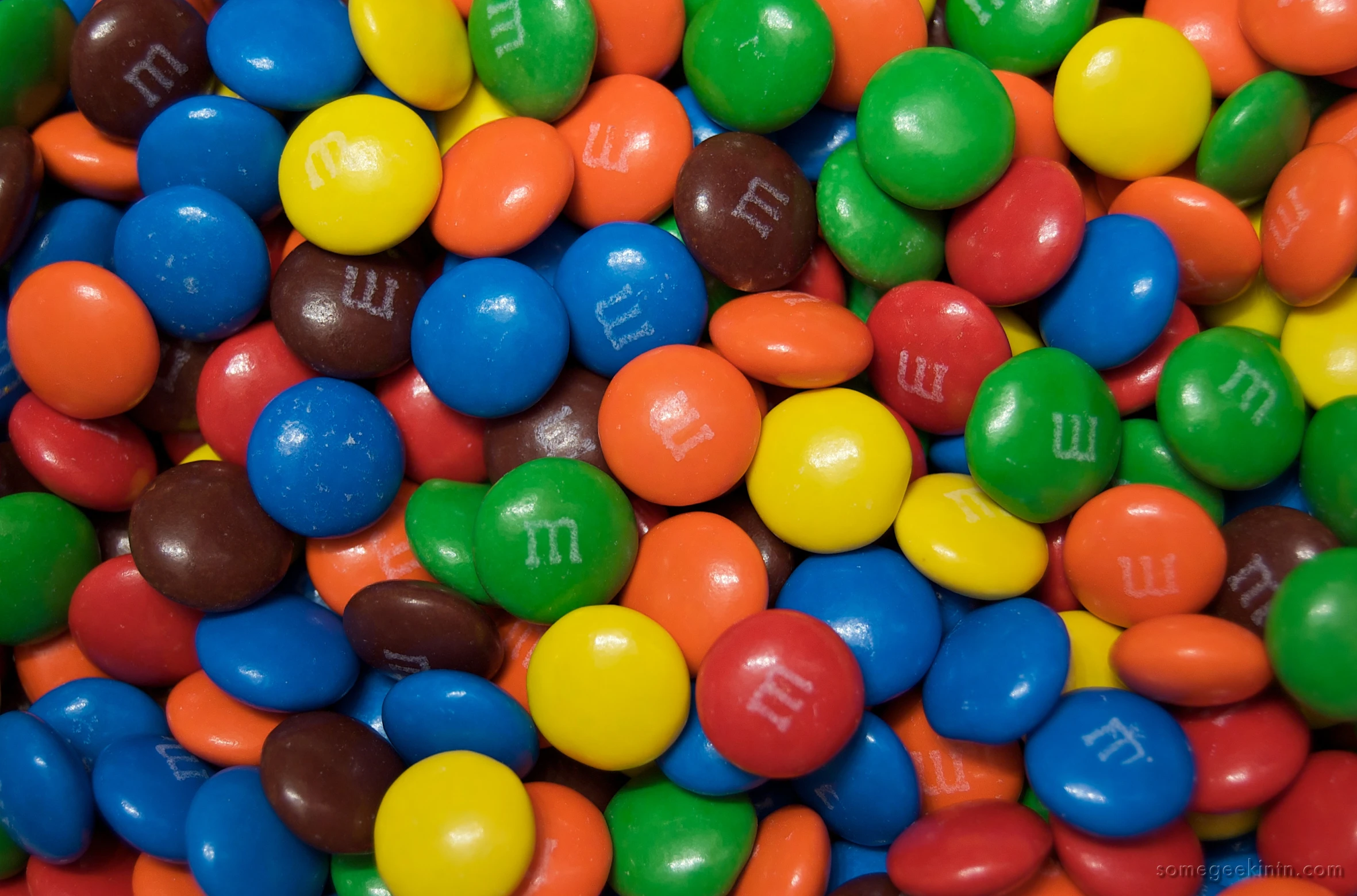 a pile of chocolate m & ms candy