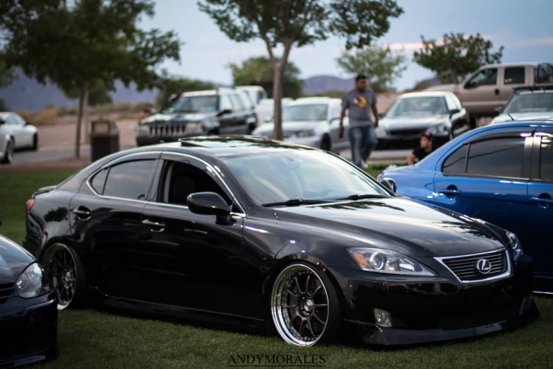 a car parked next to a couple of parked cars