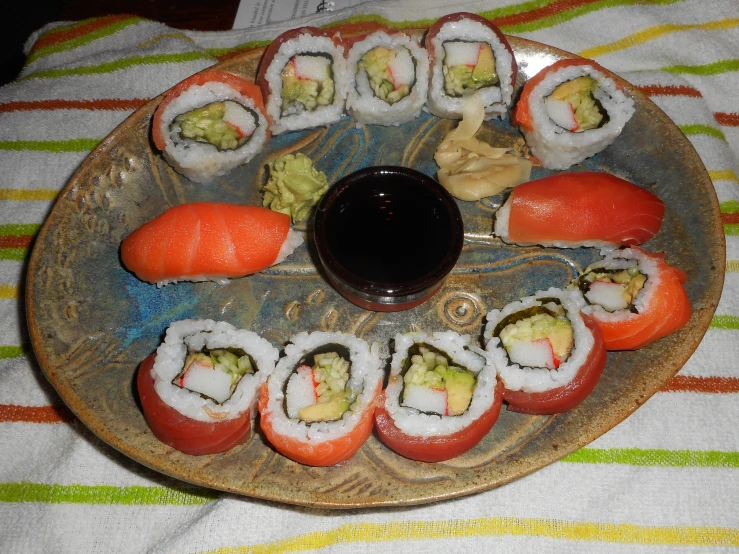 a plate with various sushi rolls on it