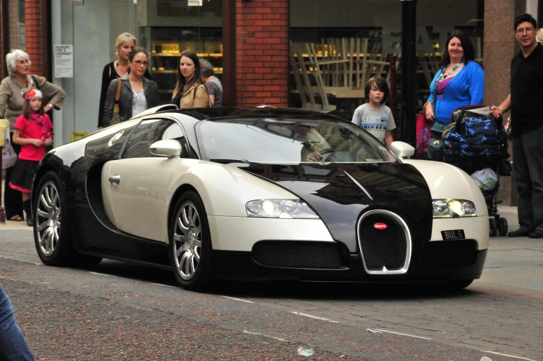 black and white car parked on the side of the street