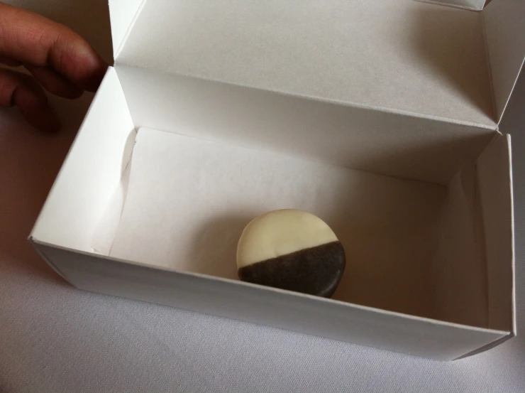 a box filled with donuts sitting on top of a table