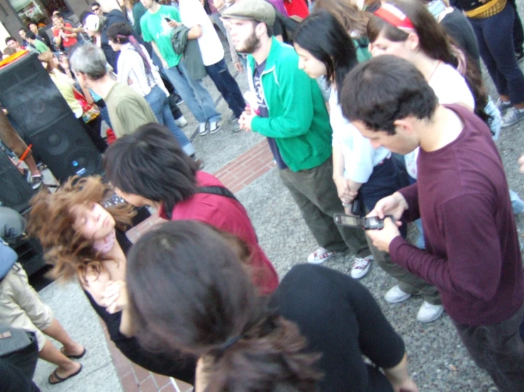 group of people in street crowded together