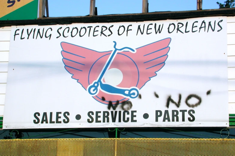 a banner advertising a sports store called flying scooters of new orleans