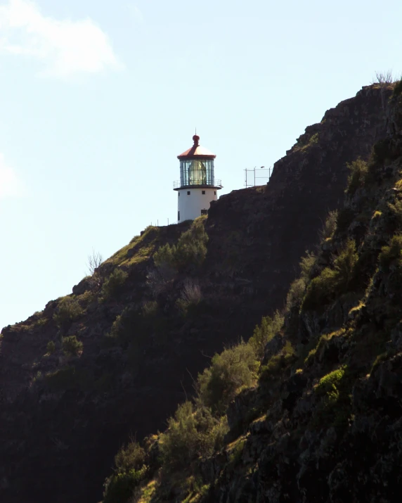 a street light is suspended above a steep hill