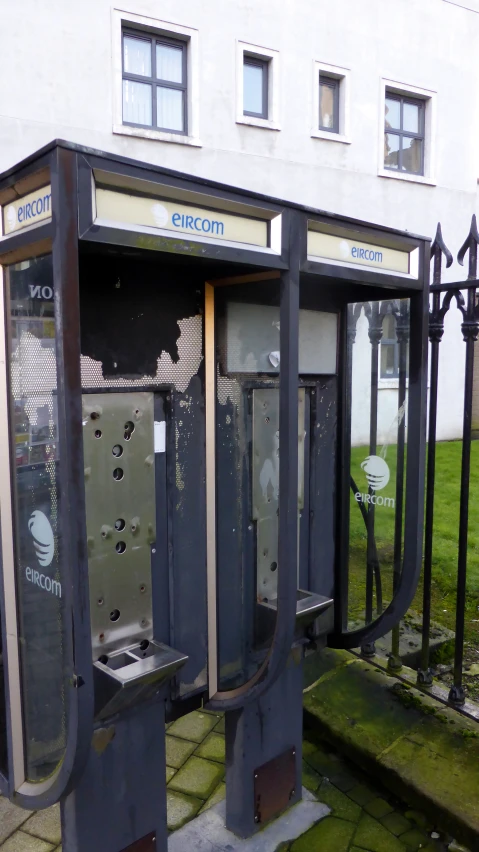 three portable phone booths are next to each other