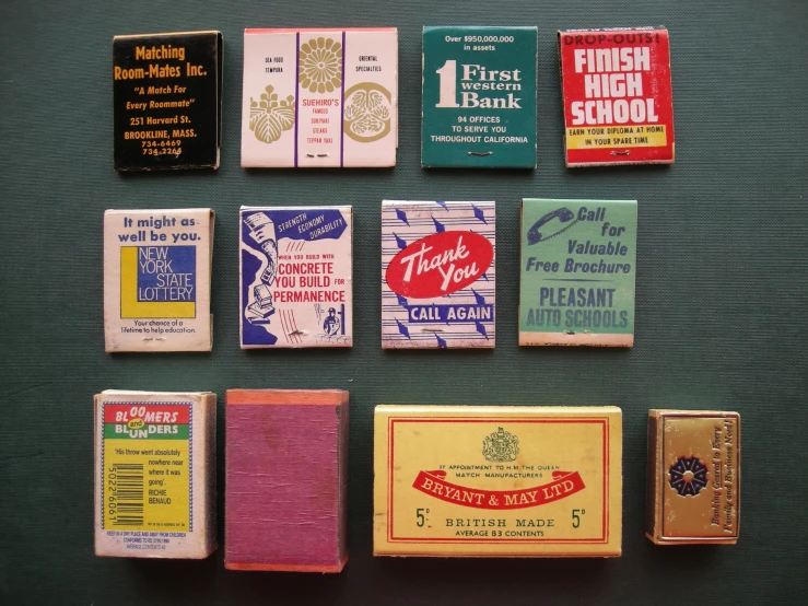 nine matchbooks are laid out on a table