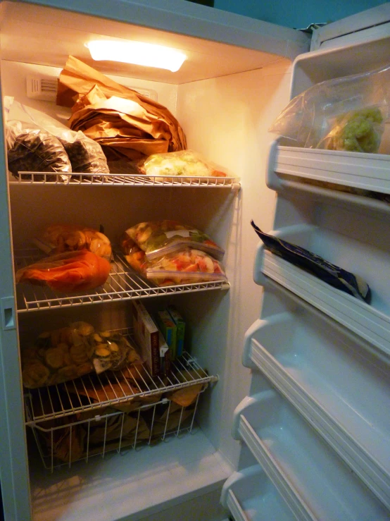 a refrigerator filled with food and vegetables