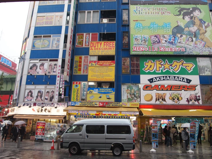 a busy city street with advertits on buildings