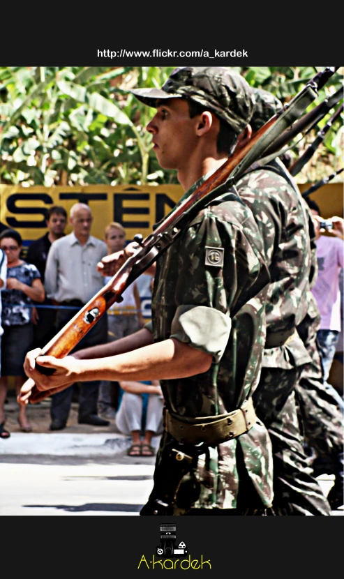 a man in uniform playing a game with a rifle