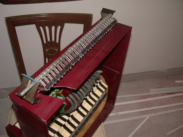 a piano is sitting in the middle of a floor