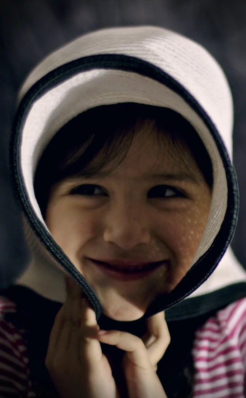 a close up of a person wearing a hat