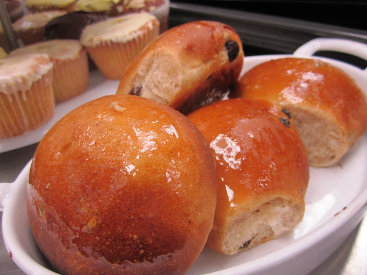 small pastries and cupcakes sit in the tray