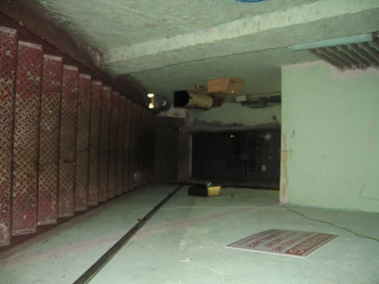 an empty parking lot inside a cement building