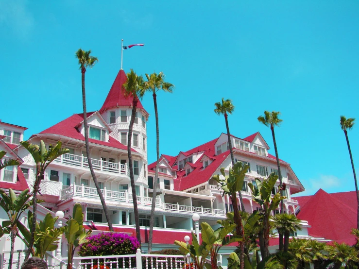 a view of a very pretty building with red roofs