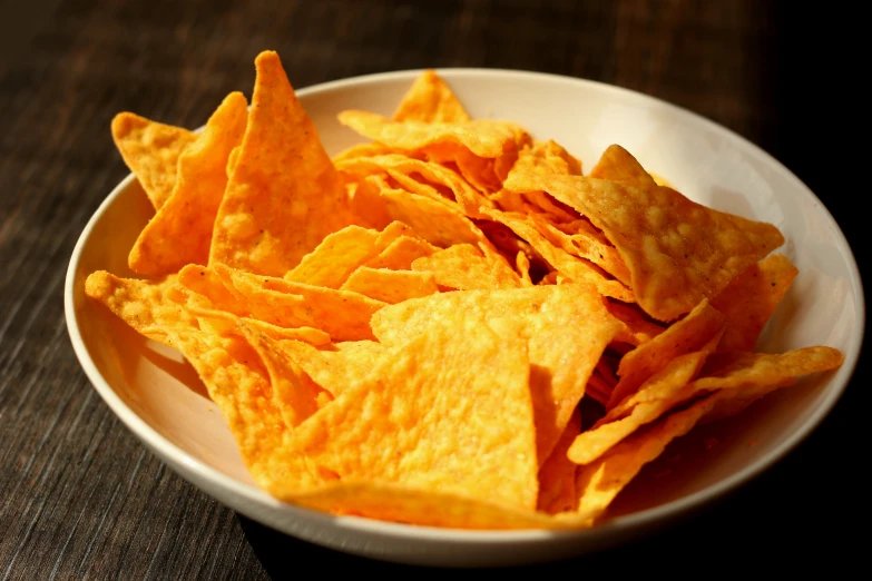 a white plate topped with tortilla chips