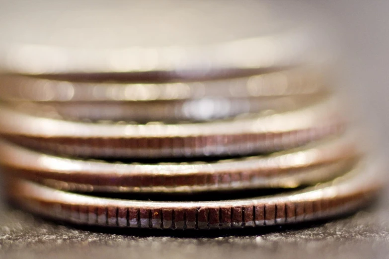 a stack of gold rings on top of a counter