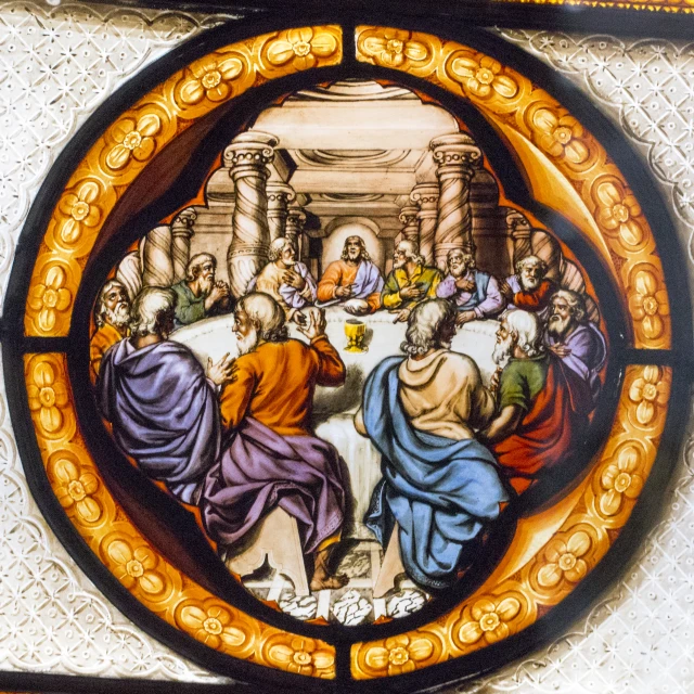 painting on stained glass with a depiction of jesus at the dinner table