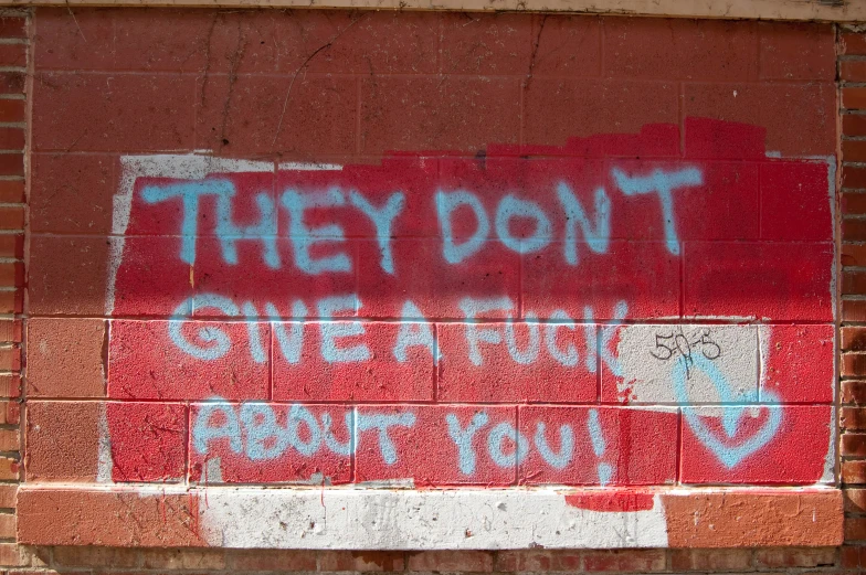 the painted on brick wall is telling someone they don't give a fight for what you want