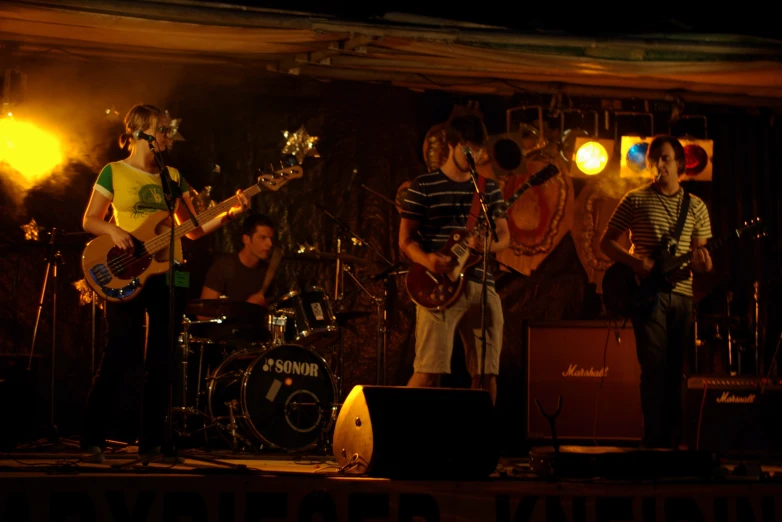 a group of people standing on top of a stage