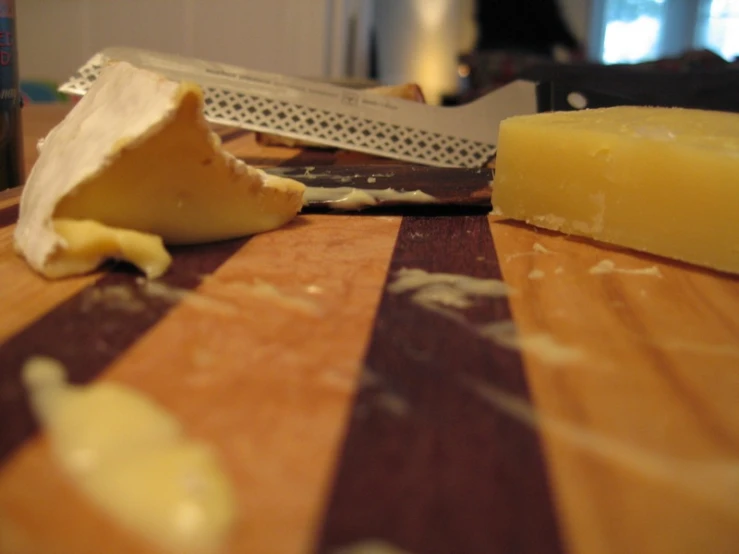 a  board topped with a cheese knife