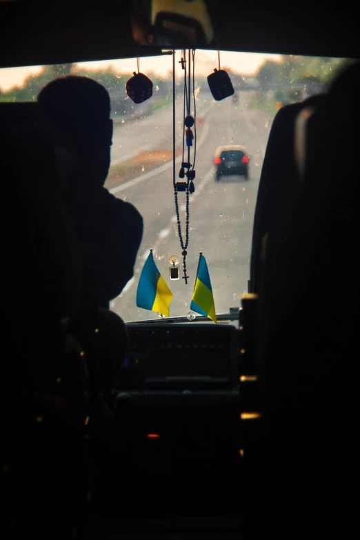 a view from inside a car looking out at the street