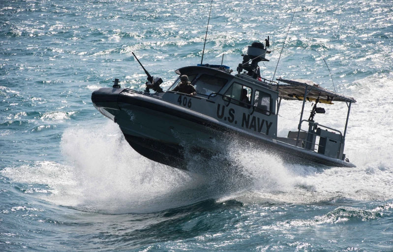 a boat rides through choppy waves on a blue ocean