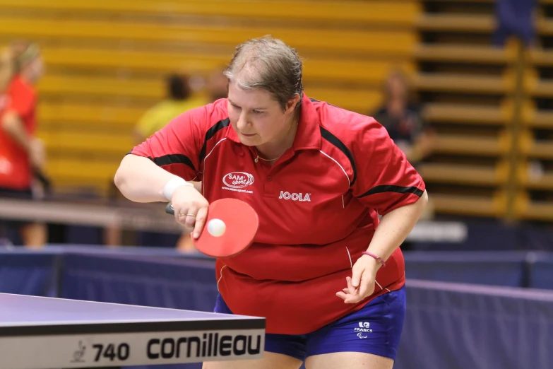 a woman is swinging a tennis racket at a ball