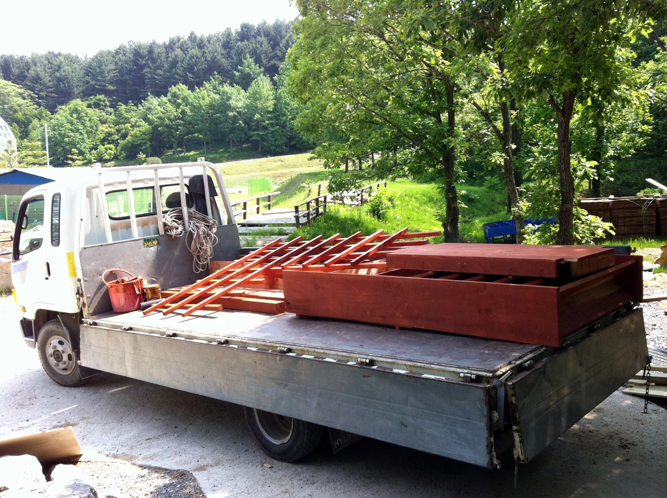 a big truck is filled with wooden pallets