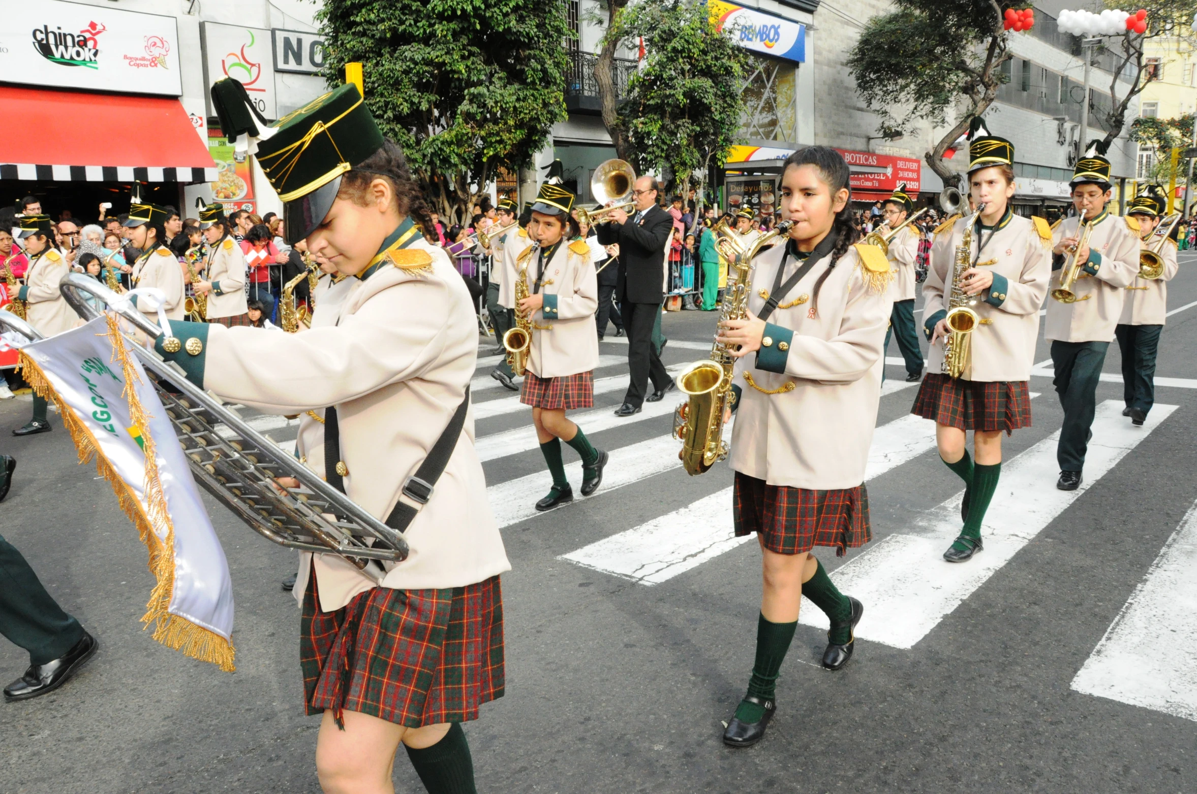 a parade with people marching down the street