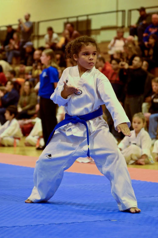 a  doing karate in front of an audience