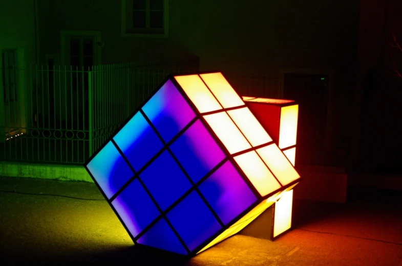 a glowing cube lit up in the dark