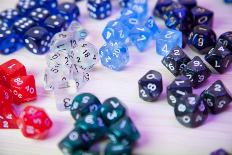 a set of seven sided dice arranged on a table