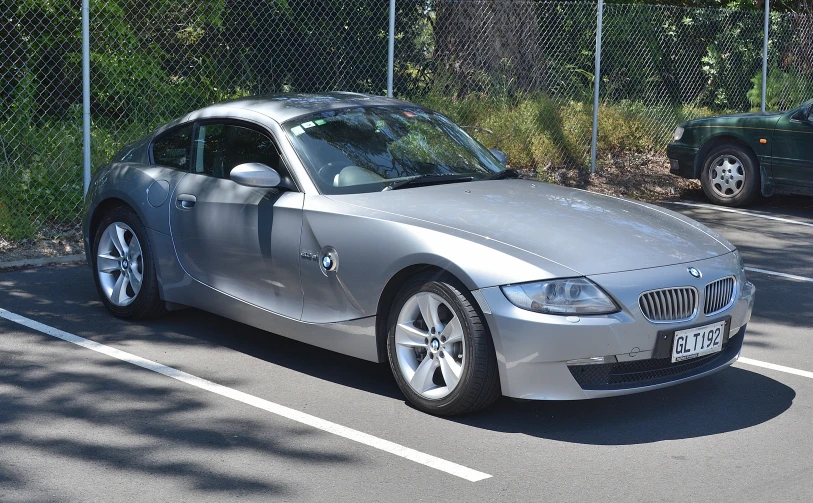 a silver sports car parked in the parking lot