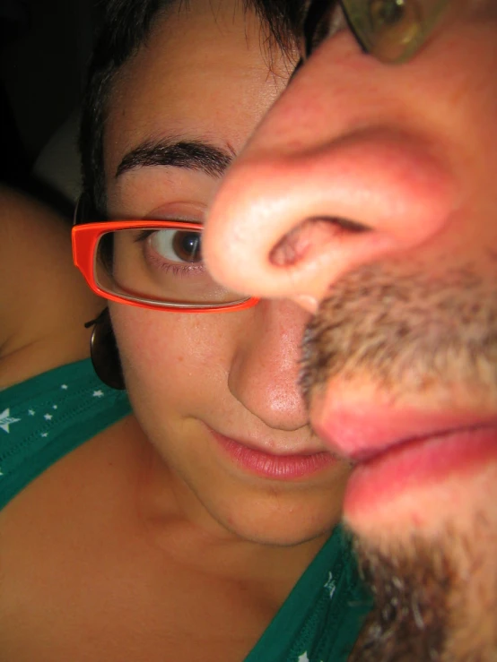 a close up of a person wearing glasses