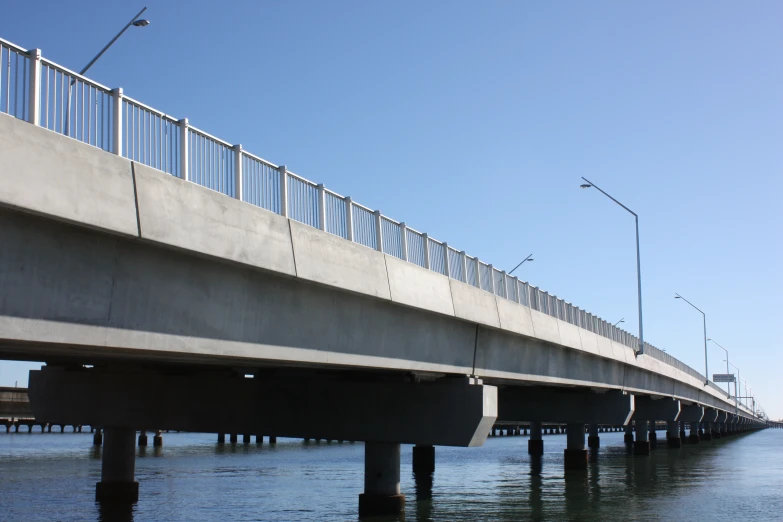 the bridge spans the water from one side to another