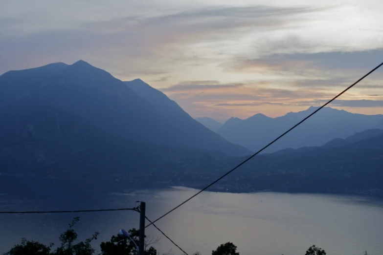 the mountains are very high in the sky with a view of some water