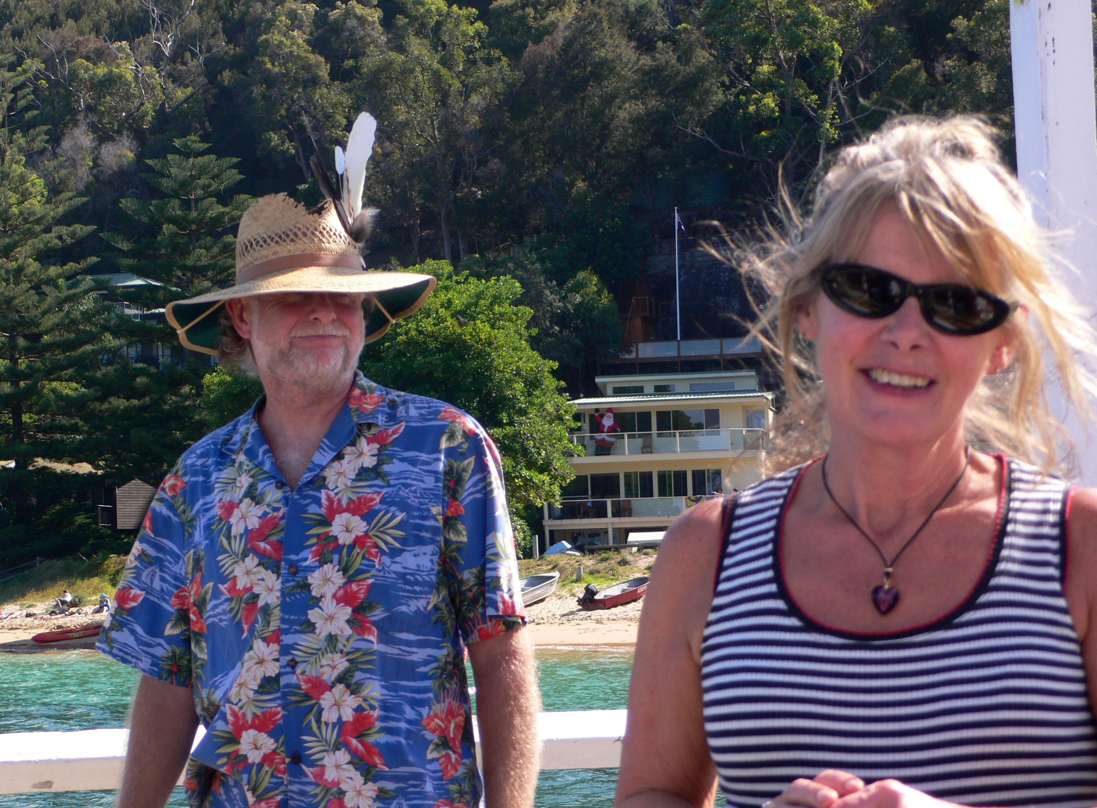 two people in matching clothing are smiling for the camera