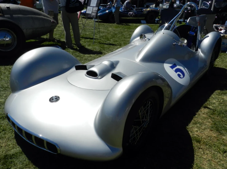 an older car with a racing emblem on it