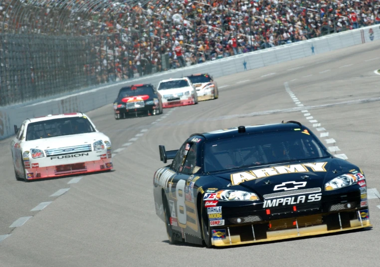 a car on the street during a race with people in the audience