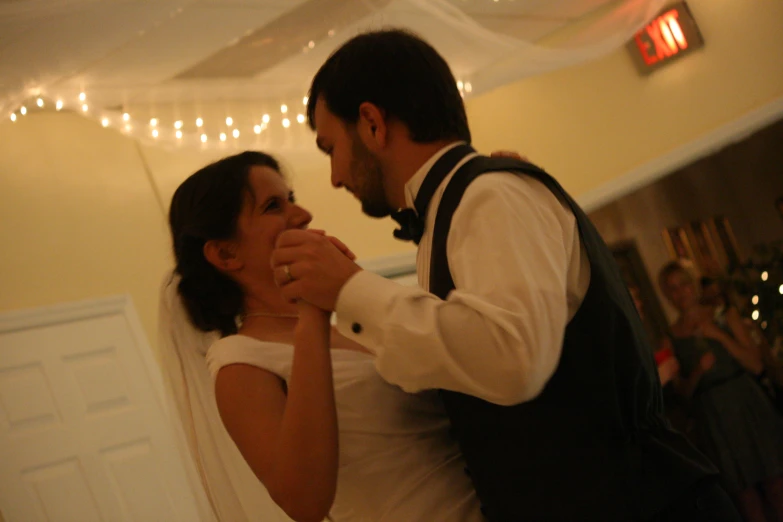 a man and a woman on the dance floor together