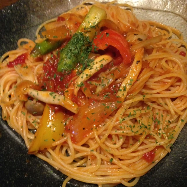 the noodles are covered with various vegetables