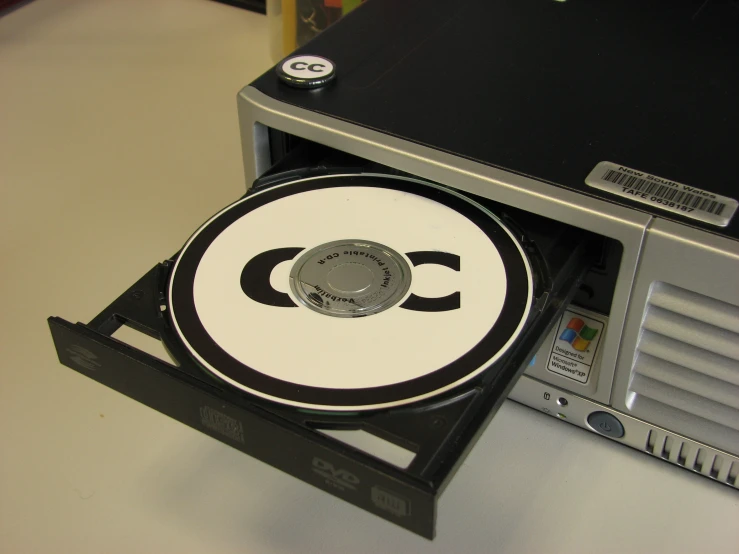 a dvd player with its lid open sitting on a table