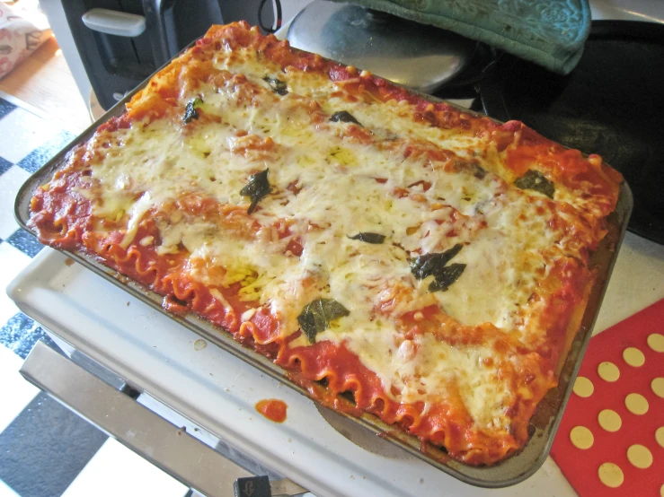 an up close image of the meat lasagna casserole on the stove