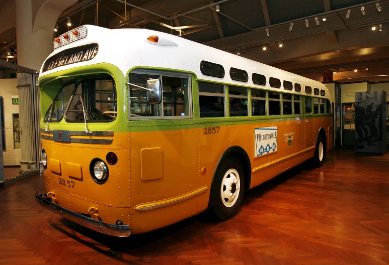 a passenger bus parked in the middle of a museum