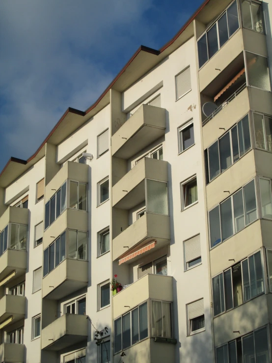 a building with many balconies and windows