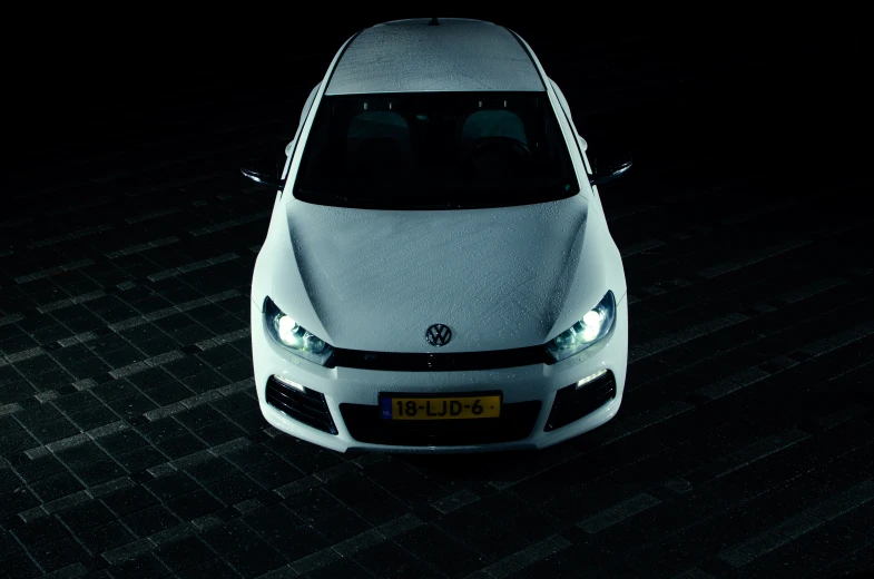 a car is shown sitting in the dark
