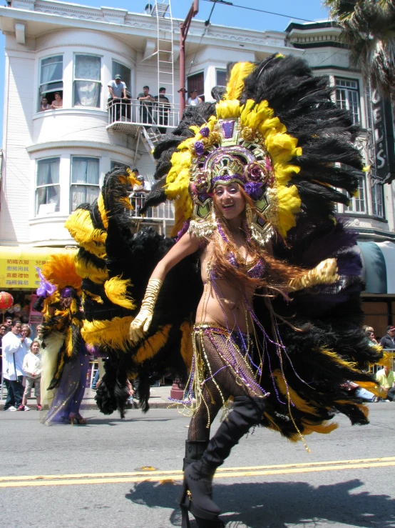 an elaborately dressed costume on display in front of a building